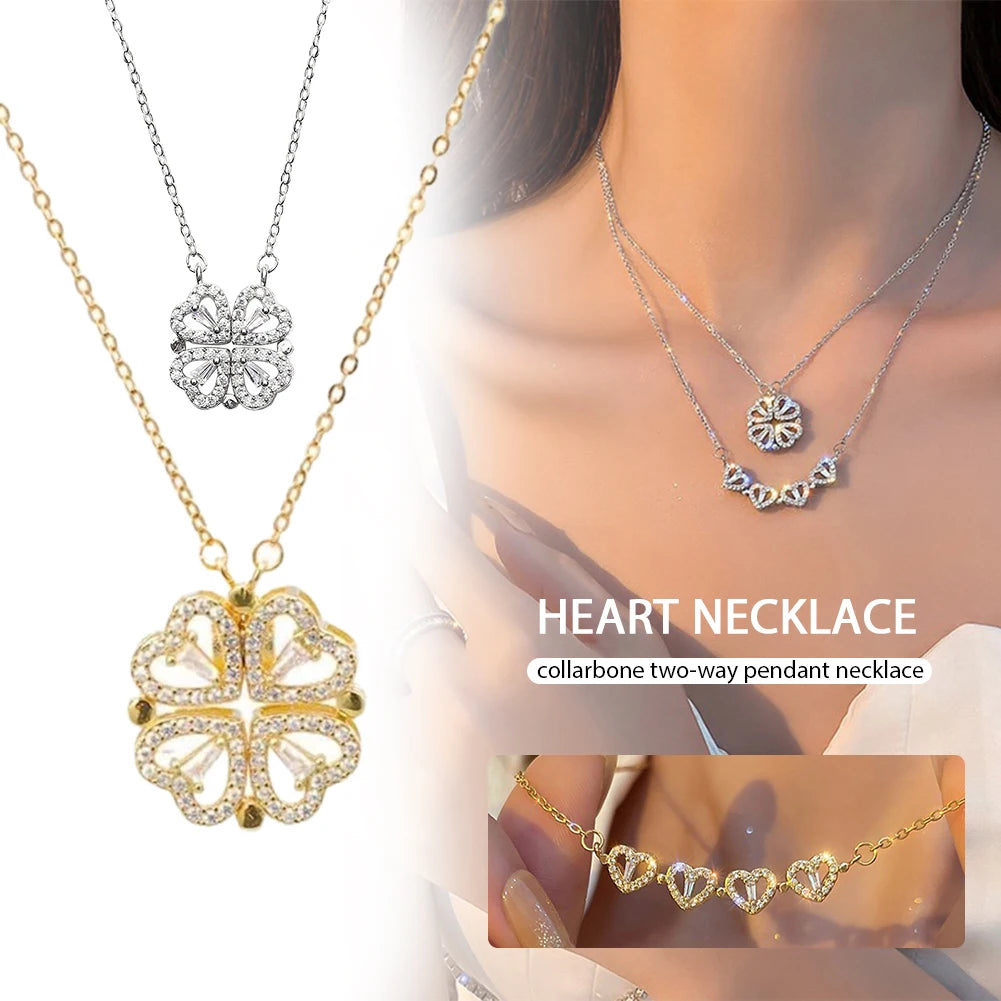 gold layered necklace — one chain with a four-leaf clover pendant and the other with small heart-shaped pendants.